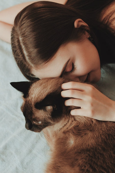 Why do cats eat our hair and their fur?